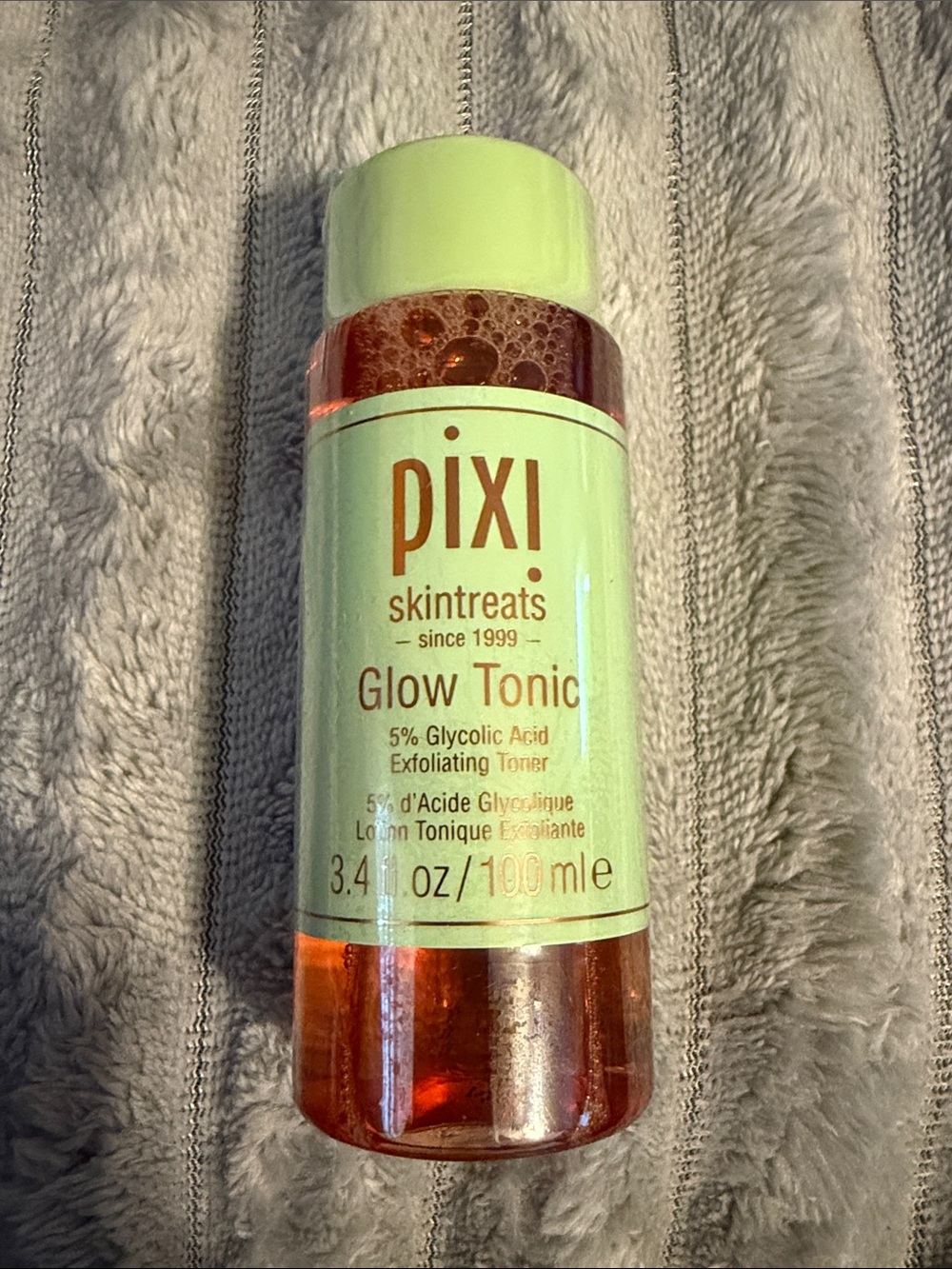 Pixi Glow Tonic - Light Green Bottle with Orange Liquid